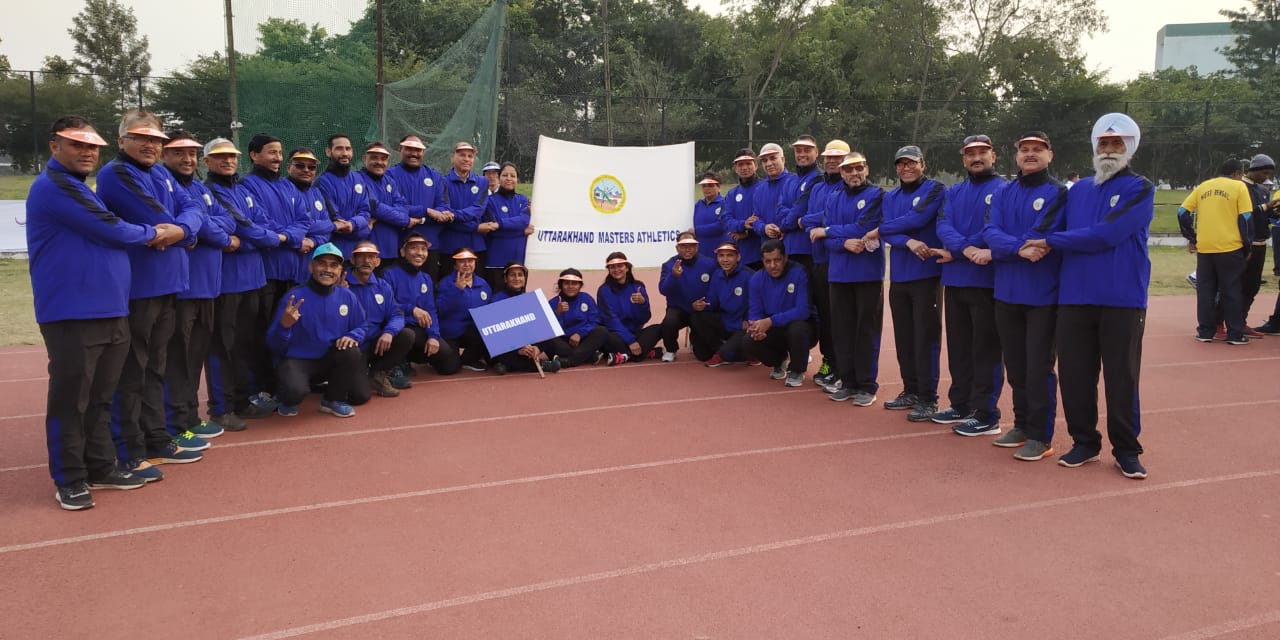 Uttarakhand Masters Athletics team gathered on the track